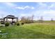 Picturesque backyard with gazebo and grassy area, ideal for outdoor activities and relaxation at 4922 Birmingham Dr, Indianapolis, IN 46235