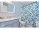 Bathroom featuring blue walls, marble countertop, and floral shower curtain at 4922 Birmingham Dr, Indianapolis, IN 46235