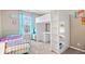 bedroom featuring a bunk bed, storage unit, a single bed, and natural lighting at 4922 Birmingham Dr, Indianapolis, IN 46235