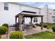 Stylish backyard gazebo featuring a seating area and grill, perfect for outdoor entertaining and relaxation at 4922 Birmingham Dr, Indianapolis, IN 46235