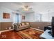 Comfortable loft area with a sofa, hardwood floors, and neutral wall colors at 4922 Birmingham Dr, Indianapolis, IN 46235