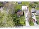 An aerial shot of a property with a well-maintained lawn, garage, and ample parking space for multiple cars at 502 N Maple St, Ingalls, IN 46048