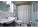 Bathroom with a shower/tub, decorative mirror, and good lighting at 502 N Maple St, Ingalls, IN 46048