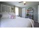 Bedroom with bed, soft decor, ceiling fan and a pair of windows at 502 N Maple St, Ingalls, IN 46048