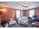 Cozy bedroom with carpet, ceiling fan, good natural light, and relaxing decor at 502 N Maple St, Ingalls, IN 46048