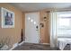 Inviting entryway with wood-look floors, and a convenient key rack creates a warm welcome for guests at 502 N Maple St, Ingalls, IN 46048
