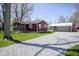 The exterior of this home shows the house, detached garage, and gravel driveway at 502 N Maple St, Ingalls, IN 46048