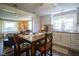 Eat-in kitchen includes new light fixture, white cabinets, and plenty of counter space at 502 N Maple St, Ingalls, IN 46048