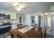 Eat-in kitchen with white cabinets, stainless steel appliances, and ample cabinet space at 502 N Maple St, Ingalls, IN 46048
