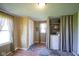 An organized laundry area with a washer and dryer, utility sink and storage at 502 N Maple St, Ingalls, IN 46048