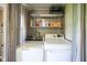 A view of the laundry machines and some shelves that include things like detergent at 502 N Maple St, Ingalls, IN 46048