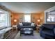 Inviting living room with hardwood floors, modern furniture, and large window at 502 N Maple St, Ingalls, IN 46048