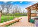 Large backyard deck with wooden bench and cat enclosure, perfect for enjoying outdoor activities at 5126 Shadow Pointe Dr, Indianapolis, IN 46254