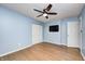 Bedroom features hardwood floors, ceiling fan, and a mounted television at 5126 Shadow Pointe Dr, Indianapolis, IN 46254