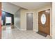 Inviting entryway with tile flooring, decorative front door, and access to living space at 5126 Shadow Pointe Dr, Indianapolis, IN 46254