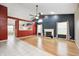 Spacious living room featuring hardwood floors, fireplace, and an open layout to the kitchen at 5126 Shadow Pointe Dr, Indianapolis, IN 46254