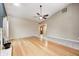 Bright living room showcasing hardwood floors and a cozy ambiance with neutral walls at 5126 Shadow Pointe Dr, Indianapolis, IN 46254
