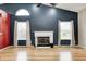 Cozy living room with vaulted ceilings, a fireplace, and large windows offering ample light at 5126 Shadow Pointe Dr, Indianapolis, IN 46254