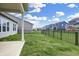 Backyard view showcases black metal fencing and an open green lawn at 5309 Spyglass Dr, Whitestown, IN 46075