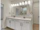 Bathroom featuring a double sink vanity with quartz counters, modern fixtures, and framed mirror at 5309 Spyglass Dr, Whitestown, IN 46075