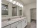 Bathroom featuring double sink vanity with quartz counters, modern fixtures, and a framed mirror at 5309 Spyglass Dr, Whitestown, IN 46075