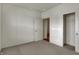 Neutral bedroom featuring carpet and walk in closet with shelf for storage at 5309 Spyglass Dr, Whitestown, IN 46075