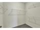 Walk-in closet with ample metal shelving and gray carpet at 5309 Spyglass Dr, Whitestown, IN 46075