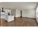 Spacious living room with modern kitchen featuring stainless steel appliances and a large island at 5309 Spyglass Dr, Whitestown, IN 46075