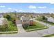 Eye-catching aerial view of a well-kept home boasting a neat lawn and brick accents at 5817 Thompson Park Blvd, Indianapolis, IN 46237