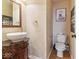 Charming half bathroom with decorative accents, vessel sink, and tiled floors at 5817 Thompson Park Blvd, Indianapolis, IN 46237
