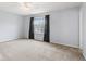 Inviting bedroom with large window, carpeted floors, and ceiling fan providing both comfort and style at 5817 Thompson Park Blvd, Indianapolis, IN 46237