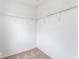 Walk-in closet maximizing storage with wire shelving and carpet, perfect for organizing belongings efficiently at 5817 Thompson Park Blvd, Indianapolis, IN 46237