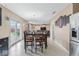 Open floor plan with dining area that leads to living room and backyard patio at 5817 Thompson Park Blvd, Indianapolis, IN 46237