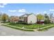 Corner lot home featuring a tidy lawn, brick accents, and an attached garage at 5817 Thompson Park Blvd, Indianapolis, IN 46237