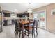 Modern kitchen and open dining area with ample seating and natural light at 5817 Thompson Park Blvd, Indianapolis, IN 46237
