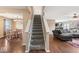 Inviting stairway leads to the spacious living area with an adjacent dining area at 5817 Thompson Park Blvd, Indianapolis, IN 46237