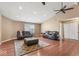 Open-concept living area with high ceilings, hardwood floors, and ample seating at 5817 Thompson Park Blvd, Indianapolis, IN 46237