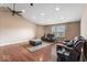 Spacious living room features hardwood floors, a ceiling fan, and ample natural light at 5817 Thompson Park Blvd, Indianapolis, IN 46237