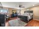 Spacious main bedroom features a ceiling fan, hardwood floors and plenty of natural light at 5817 Thompson Park Blvd, Indianapolis, IN 46237