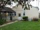 Side of house and backyard with green lawn, gazebo, and mature trees at 59 N Ridgeview Dr, Indianapolis, IN 46219