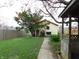 Large backyard with grass and mature trees at 59 N Ridgeview Dr, Indianapolis, IN 46219