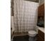 Clean bathroom featuring modern fixtures and a white ruffled shower curtain at 59 N Ridgeview Dr, Indianapolis, IN 46219