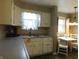 Kitchen features a double sink, and dining table with chairs at 59 N Ridgeview Dr, Indianapolis, IN 46219