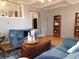 Comfortable living room with hardwood floors, blue sofas, and natural light at 59 N Ridgeview Dr, Indianapolis, IN 46219