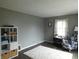 Bright living room featuring neutral gray walls and a white shag rug on modern wood flooring at 59 N Ridgeview Dr, Indianapolis, IN 46219