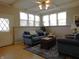 Living room features a blue couch, a dark wood coffee table, and neutral walls at 59 N Ridgeview Dr, Indianapolis, IN 46219