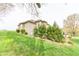 Spacious backyard featuring mature trees and lush greenery at 6081 Boulder Ct, Columbus, IN 47201