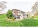 Beautiful backyard with patio, outdoor seating, barbecue, and meticulous landscaping at 6081 Boulder Ct, Columbus, IN 47201