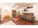 Finished basement area with a cozy reclining couch and an area to play at 6081 Boulder Ct, Columbus, IN 47201