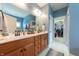 Bathroom features a double sink vanity with an adjacent walk-in closet at 6081 Boulder Ct, Columbus, IN 47201